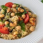 Fresh couscous salad with garden vegetables, chickpeas and cashews